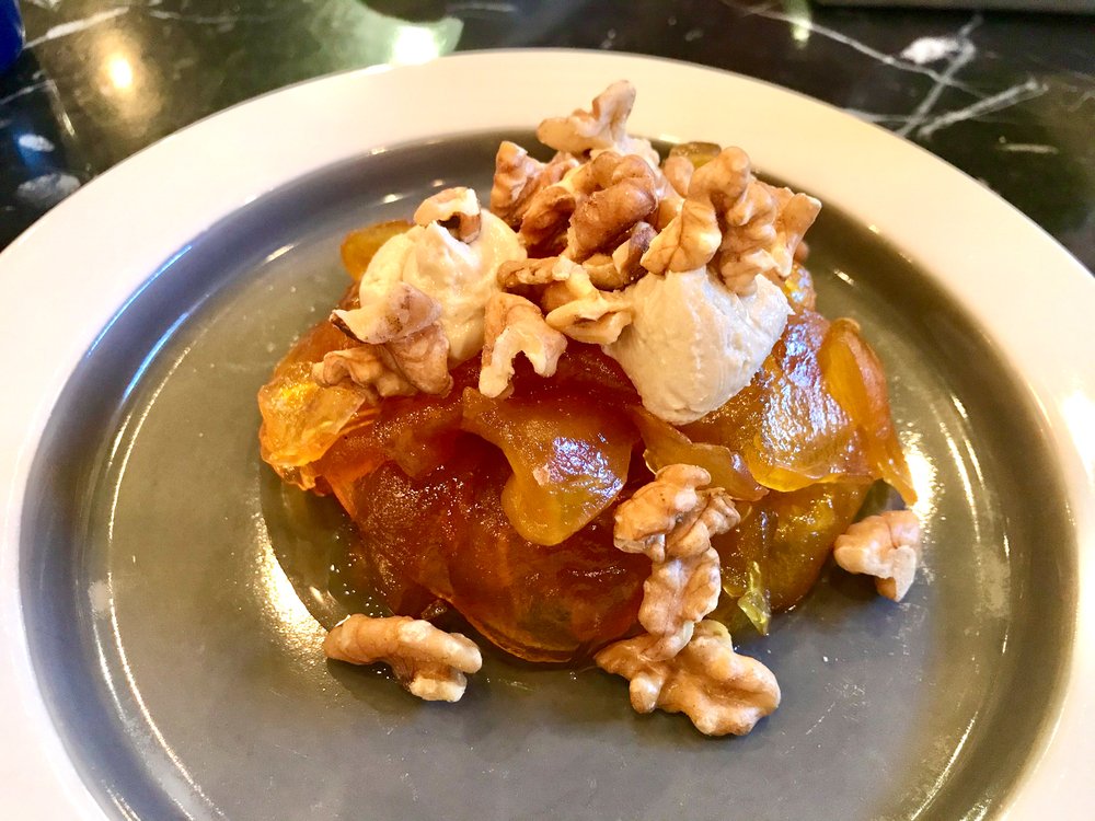 Try a Turkish dessert with walnuts and ice cream served on a plate - Kabak Tatlısı