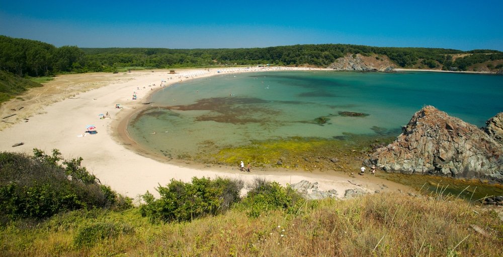 The bay of the Silistar beach, near Ahtopol, Bulgaria. One of the best beaches in Bulgaria, covered in soft sand and framed by a crystal-clear blue sky.